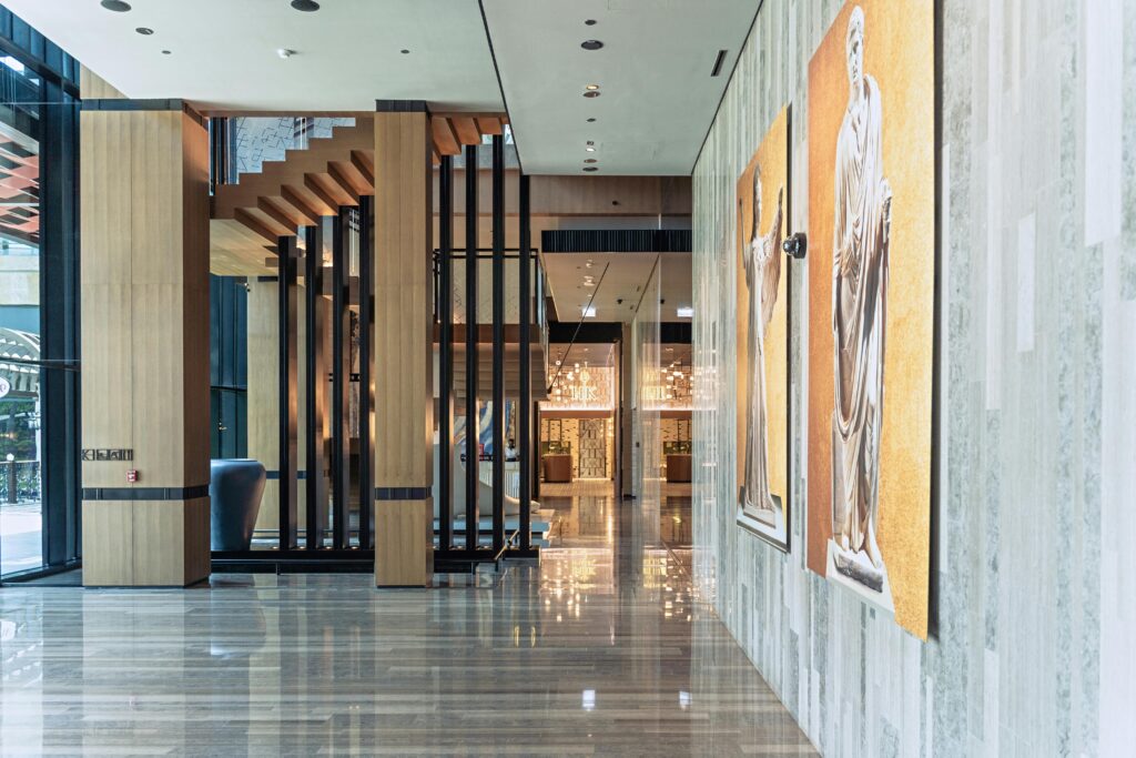 Spacious and modern hotel lobby in Dubai with elegant decor and marble floors.